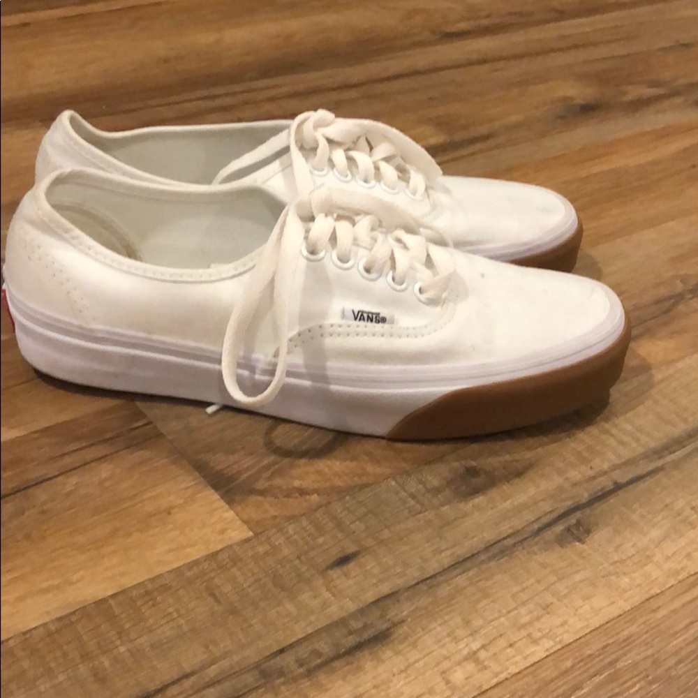 White vans with gum sole around the toe area